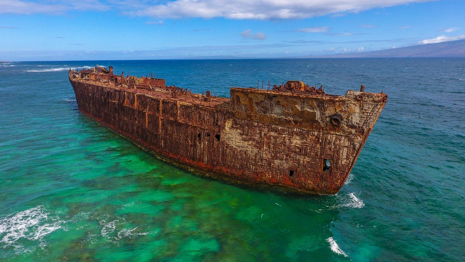 YOGN-42, the concrete fuel barge aground on the reef off Lānaʻi's north shore